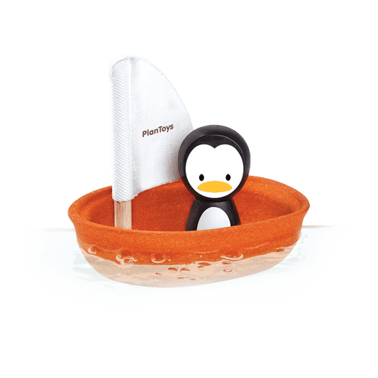 Plan Toy Penguin in boat